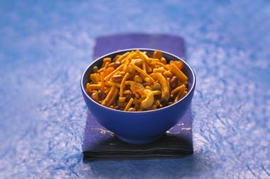 Indian Bombay mix or Chevdo served in a blue bowl