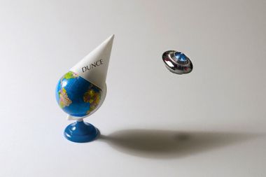 Earth with a dunce cap, and a UFO passing by