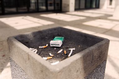 Cigarette butts and an empty pack of Newports sit in an ash tray outside of the Hart Senate Office Building