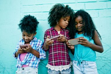Little girls on smartphones