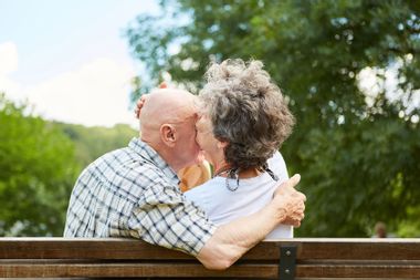 Senior Couple Embracing At Park