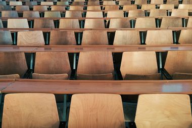 Wooden Chairs In Classroom Auditorium