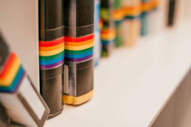 Shelf with LGBTQ awareness books at the public library