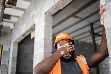 Exhausted construction worker