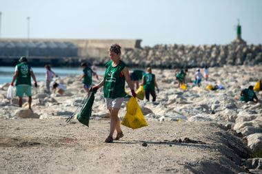 Volunteers are seen collecting waste and plastic during the cleaning of San Andrés Beach ahead of World Environment Day on June 5th.