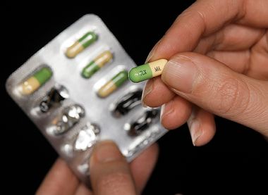 A woman holds a packet of an antidepressant drug in Leicester