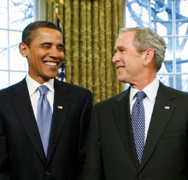 U.S. President Bush looks at President-elect Obama as former President Clinton stands by his side in Washington