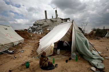 Palestinian handicapped sits outside his tent in Gaza