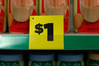 A price sign is displayed at a Dollar General store in Arvada