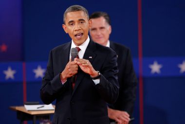 U.S. President Obama answers a questiion as Republican presidential nominee Romney listens during the second U.S. presidential campaign debate in Hempstead