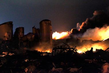 The remains of a fertilizer plant burn after an explosion at the plant in the town of West, near Waco, Texas