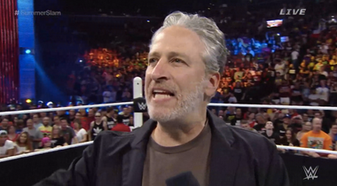 Image for Jon Stewart's first act of retirement: Attacking pro wrestler John Cena with a steel chair