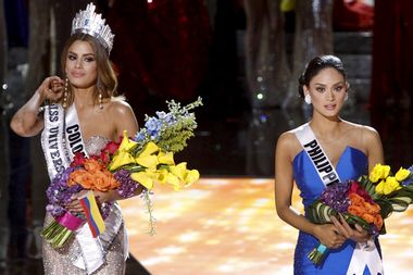 Miss Philippines Wurtzbach waits with Miss Colombia Gutierrez onstage shortly after Miss Colombia was initially crowned Miss Universe 2015 in Las Vegas