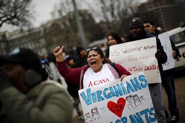 Anti-deportation demonstrators protest outside the White House in Washington
