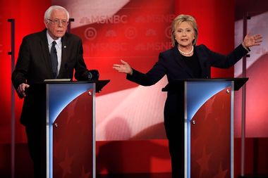 Democratic U.S. presidential candidate Senator Sanders listens as former Secretary of State Clinton speaks during the Democratic presidential candidates debate sponsored by MSNBC at the University of New Hampshire in Durham