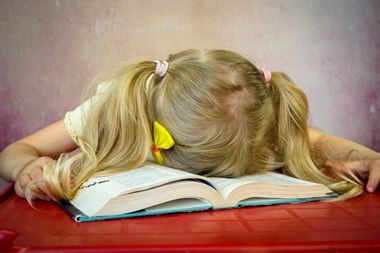 Girl Asleep on Book