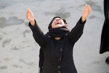 A woman reacts during a funeral of a victim who was killed in a bomb attack in Baghdad, in Najaf