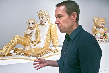 Jeff Koons near his sculptures "Michael Jackson and Bubbles," and "Amore"
