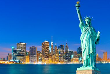 Manhattan at night; Statue of Liberty.