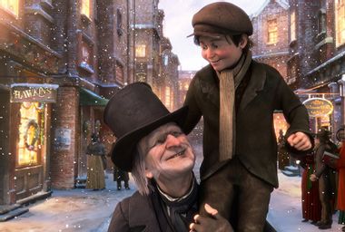 Jim Carrey as Ebenezer Scrooge and Gary Oldman as Tiny Tim in "A Christmas Carol"
