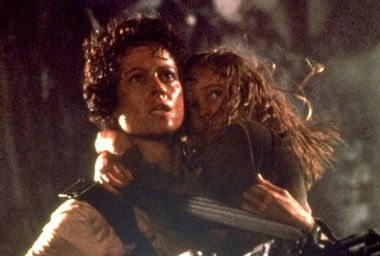 Sigourney Weaver as Ellen Ripley and Carrie Henn as Rebecca "Newt" Jorden in "Aliens"