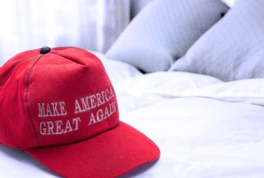 MAGA hat on bed