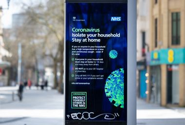 A NHS sign warning of coronavirus on Queen Street