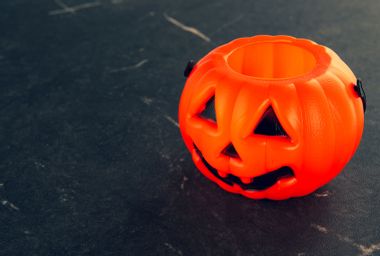 Empty Halloween pumpkin candy bucket