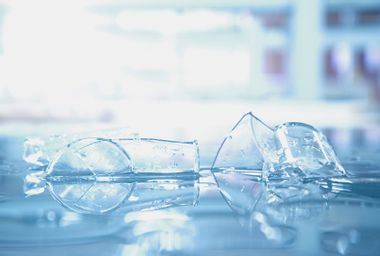 Broken beaker glass in science laboratory