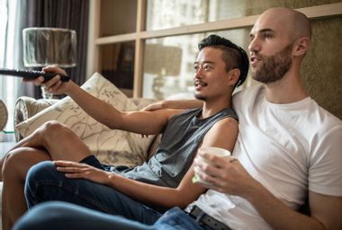 Couple watches TV at home