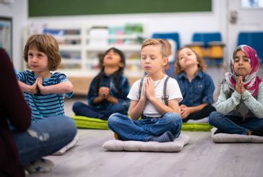 Kids having a yoga class