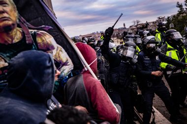 Police officers attempt to push back a pro-Trump mob trying to storm the U.S. Capitol on Jan. 6, 2021.