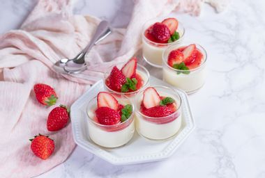 Creamy yogurt panna cotta with fresh strawberry sauce in glass