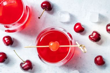 Cocktail with cherry and ice