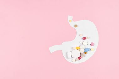 Abstract stomach made from paper with many different pills
