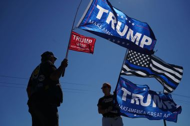 Donald Trump supporters wave flags