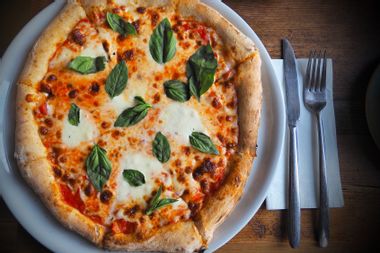 Pizza in a plate on a table