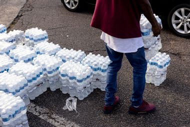Cases of bottled water are handed out at a Mississippi Rapid Response Coalition distribution site on August 31, 2022 in Jackson, Mississippi