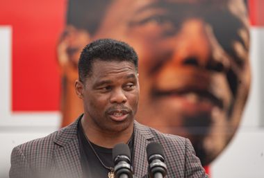 Image for Herschel Walker scolded by debate moderator for using a prop 