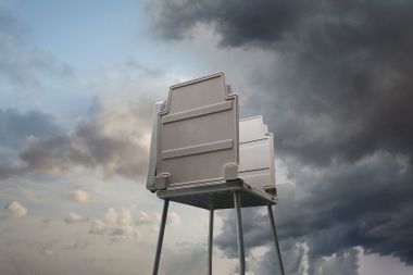 Voting booth against stormy sky