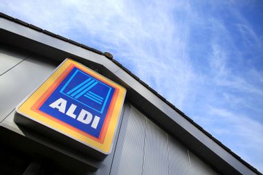 An exterior view of signage at a branch of the budget supermarket Aldi