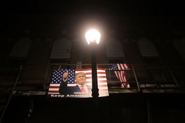 A poster of President Donald Trump is displayed along a street on October 29, 2020 in Winterset, Iowa.