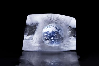 Planet earth frozen in a block of ice