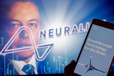 Neuralink logo is displayed on mobile with founder Elon Musk seen on screen