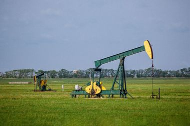 A pair of oil jacks pump crude oil from a Kansas prairie