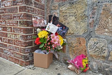 Flowers left by fans outside Graceland to pay respects to Lisa Marie Presley