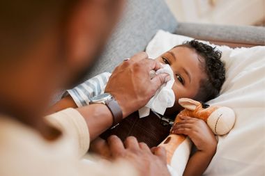 Sick little boy suffering from cold