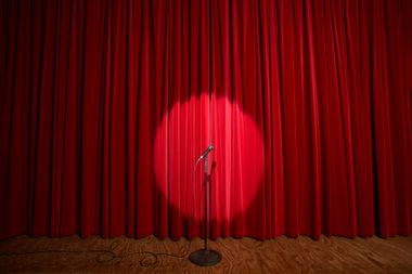 Spotlight on a microphone stand on stage