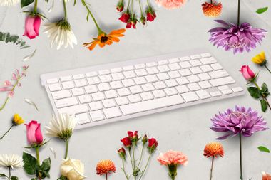 Computer keyboard and meadow flowers