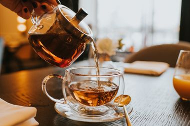 Pouring tea into a cup